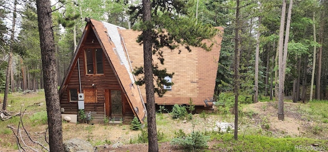 1 Ute Trl, Evergreen, CO 80439 - view of front facade featuring a forest view