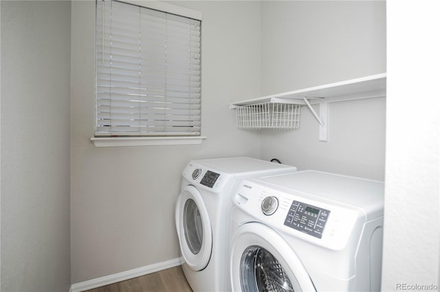 laundry area featuring hardwood / wood-style flooring and independent washer and dryer