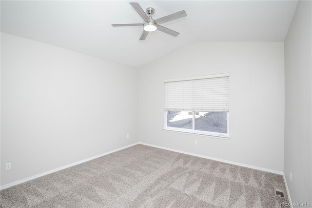 carpeted empty room with ceiling fan and lofted ceiling