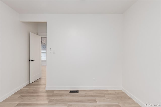 spare room featuring light hardwood / wood-style flooring