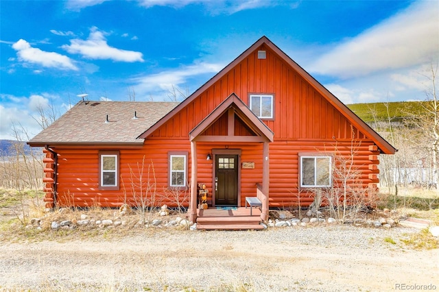 82 Sheep Ridge Rd, Fairplay, CO 80440 - log home with board and batten siding, a shingled roof, and log siding
