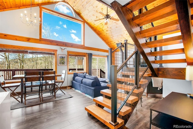 82 Sheep Ridge Rd, Fairplay, CO 80440 - living area featuring stairway, high vaulted ceiling, wood ceiling, wood finished floors, and a chandelier
