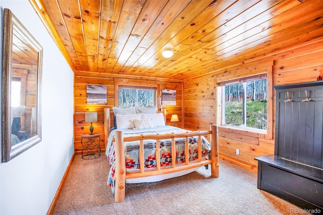 82 Sheep Ridge Rd, Fairplay, CO 80440 - bedroom featuring multiple windows, wood ceiling, wood walls, carpet, and baseboards