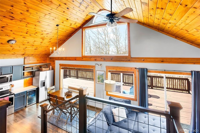 82 Sheep Ridge Rd, Fairplay, CO 80440 - dining area with vaulted ceiling, wood ceiling, ceiling fan, wine cooler, and wood finished floors