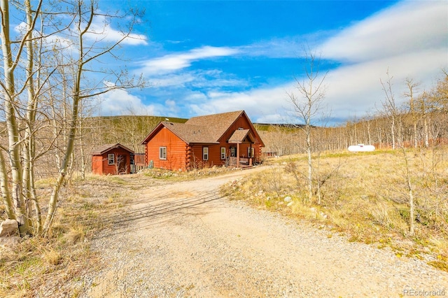 82 Sheep Ridge Rd, Fairplay, CO 80440 - log cabin with log exterior and dirt driveway