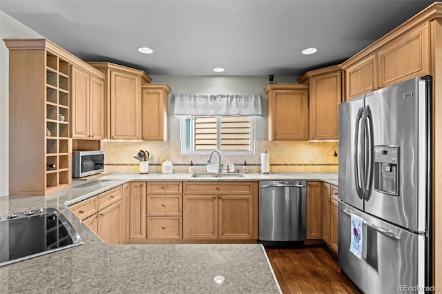 kitchen featuring stainless steel appliances, a sink, dark wood-style floors, tasteful backsplash, and recessed lighting