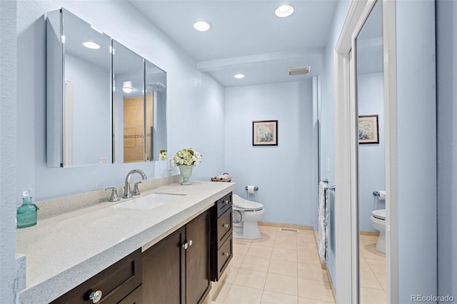 bathroom with toilet, tile patterned floors, vanity, recessed lighting, and baseboards