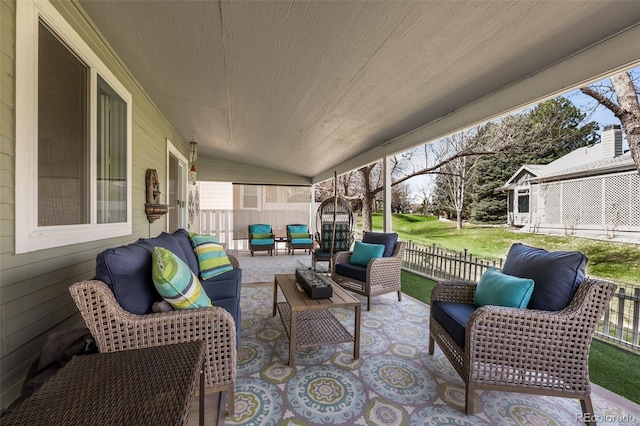 view of patio / terrace with outdoor lounge area and fence