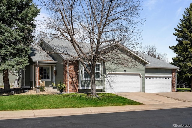 view of front of property with brick siding, a garage, concrete driveway, and a front lawn
