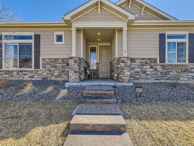 property entrance featuring stone siding