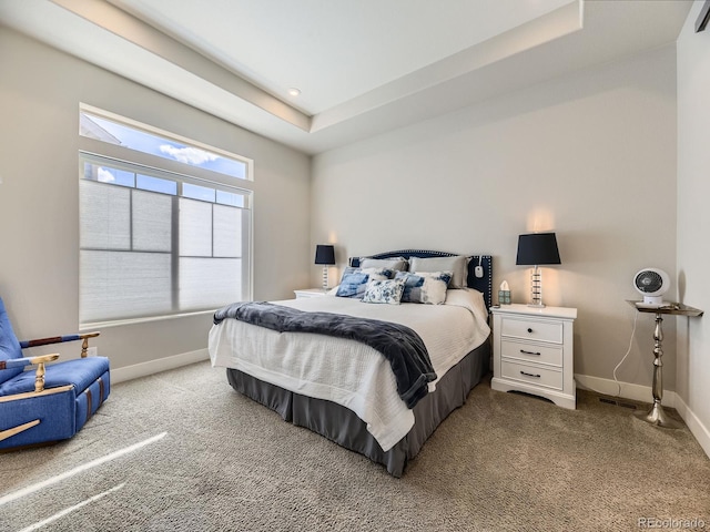 bedroom featuring recessed lighting, a raised ceiling, carpet flooring, and baseboards