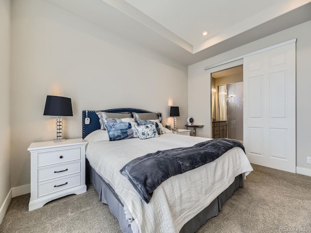 bedroom featuring recessed lighting, baseboards, connected bathroom, and light colored carpet