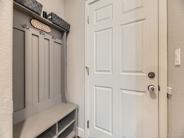 mudroom featuring a textured wall