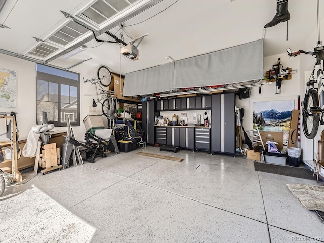 garage featuring a garage door opener