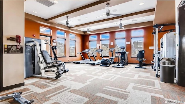 exercise room featuring carpet floors, baseboards, visible vents, and a ceiling fan