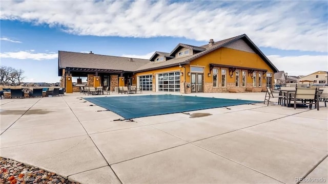 community pool with a patio