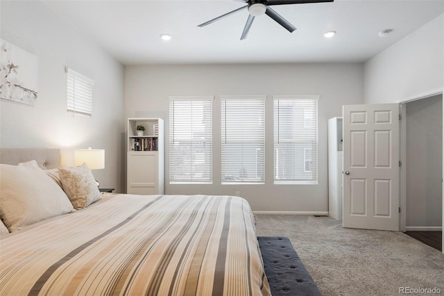 bedroom with ceiling fan, carpet floors, and baseboards