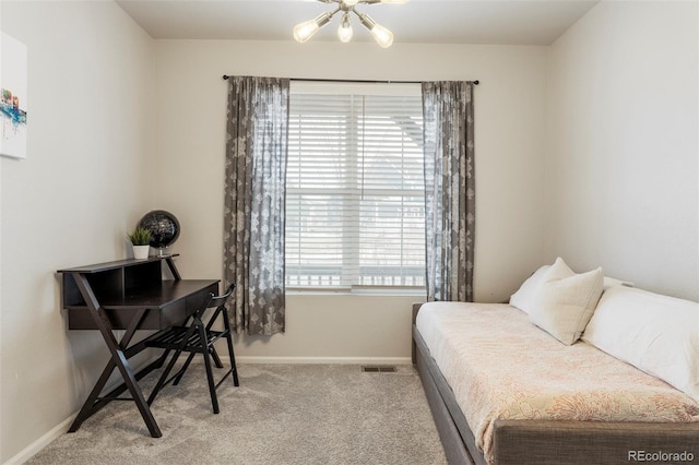 bedroom with carpet floors and baseboards