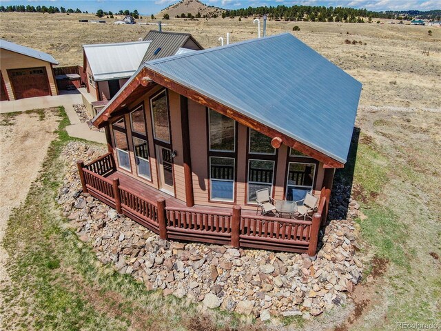 2177 County Road 341, Westcliffe, CO 81252 - rear view of property featuring metal roof, a rural view, and a detached garage