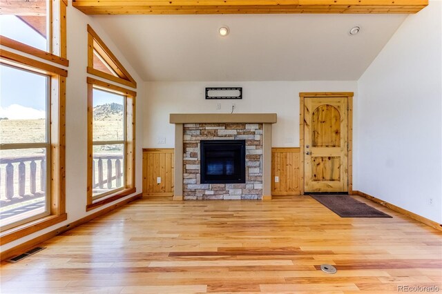 2177 County Road 341, Westcliffe, CO 81252 - unfurnished living room featuring lofted ceiling, light wood-style flooring, a fireplace, recessed lighting, and wainscoting