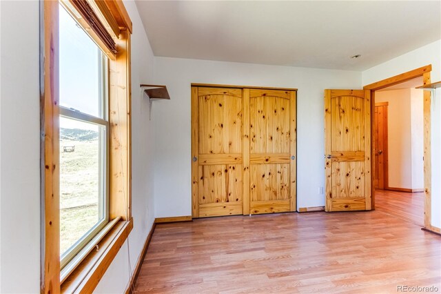 2177 County Road 341, Westcliffe, CO 81252 - unfurnished bedroom with light wood-style floors and baseboards