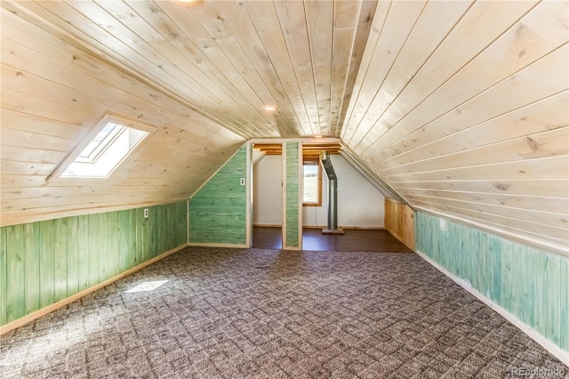 2177 County Road 341, Westcliffe, CO 81252 - bonus room with wood ceiling, wooden walls, carpet flooring, lofted ceiling, and a skylight