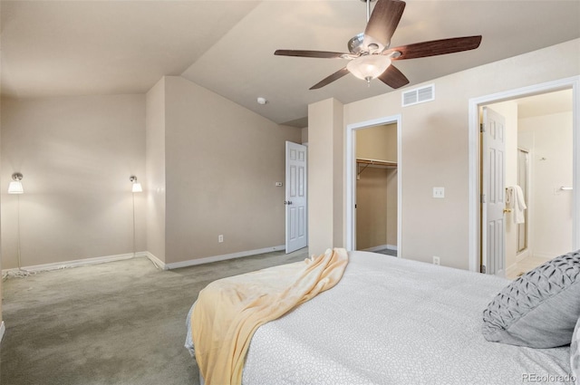 bedroom featuring visible vents, a ceiling fan, carpet flooring, vaulted ceiling, and baseboards