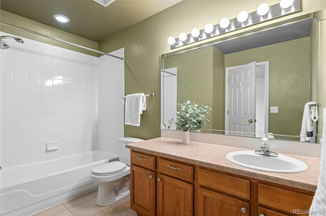 bathroom featuring a textured wall, toilet, vanity, tile patterned flooring, and shower / bathtub combination