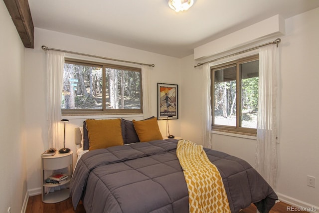 135 Nugget Ln, Alma, CO 80420 - bedroom featuring wood finished floors and multiple windows