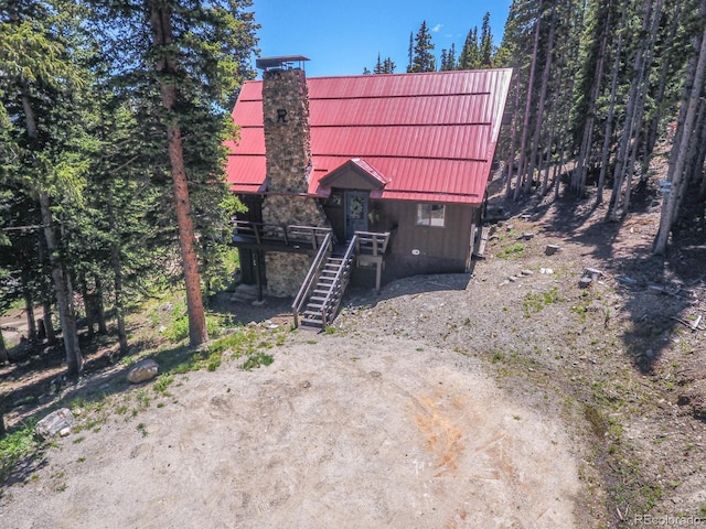 135 Nugget Ln, Alma, CO 80420 - rustic home with stairway, a metal roof, and a standing seam roof
