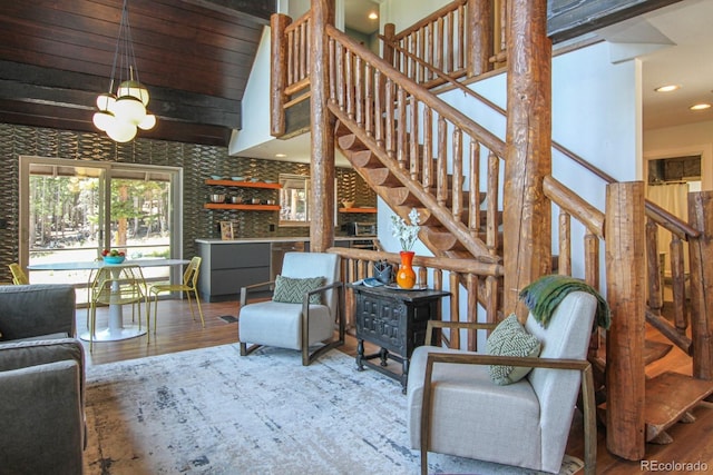 135 Nugget Ln, Alma, CO 80420 - living room featuring stairway, wood finished floors, recessed lighting, and a high ceiling