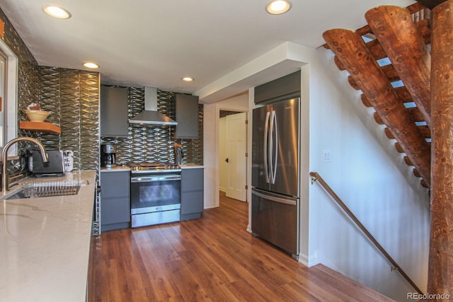 135 Nugget Ln, Alma, CO 80420 - kitchen featuring wall chimney range hood, appliances with stainless steel finishes, gray cabinets, recessed lighting, and decorative backsplash