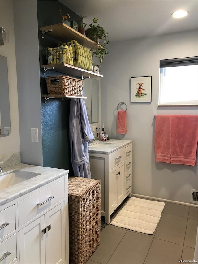 laundry area with recessed lighting, a sink, and tile patterned floors