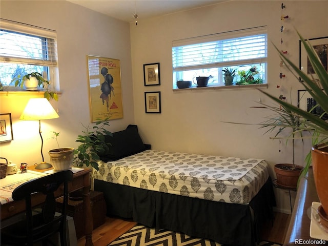 bedroom with wood finished floors