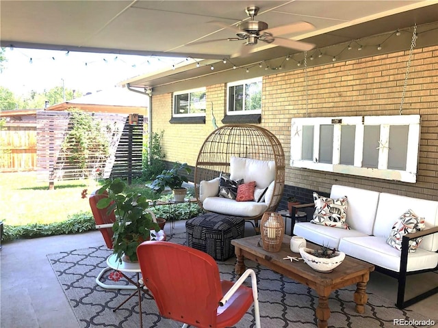 view of patio / terrace featuring outdoor lounge area, fence, and a ceiling fan