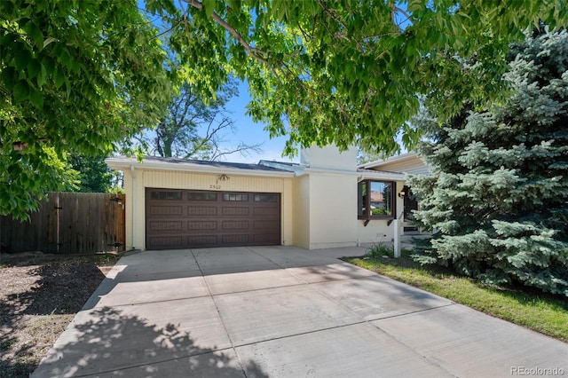 ranch-style house featuring a garage