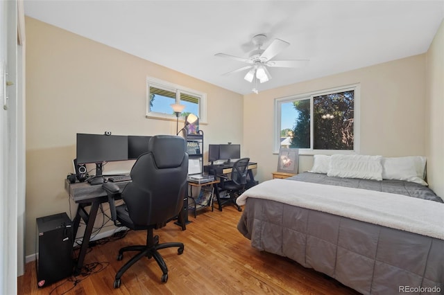 bedroom featuring hardwood / wood-style floors and ceiling fan