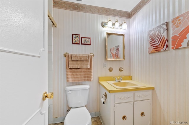 bathroom with vanity, toilet, and tile patterned flooring