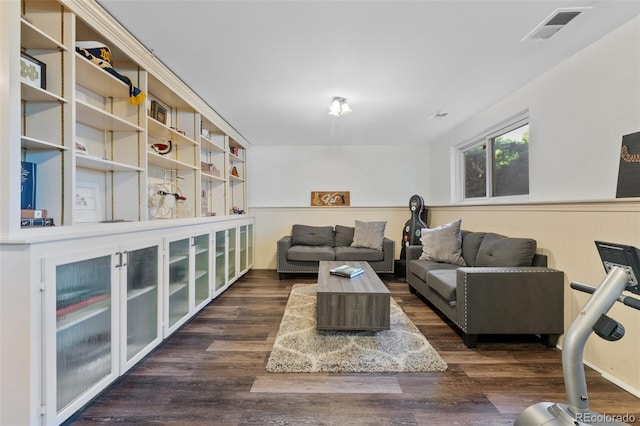 living room with dark hardwood / wood-style flooring