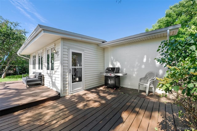 wooden terrace featuring area for grilling