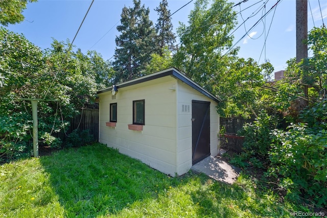 view of outdoor structure with a yard