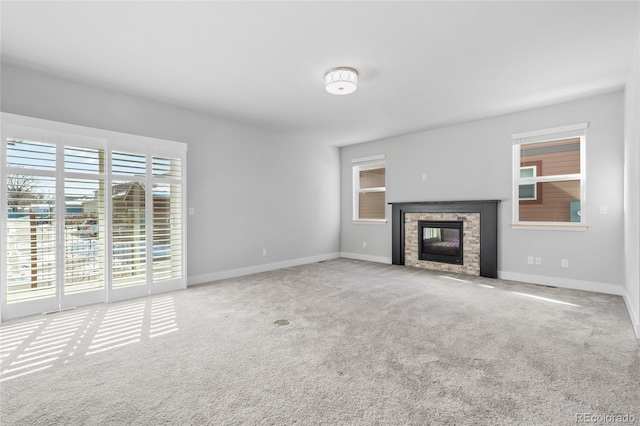 unfurnished living room featuring carpet flooring