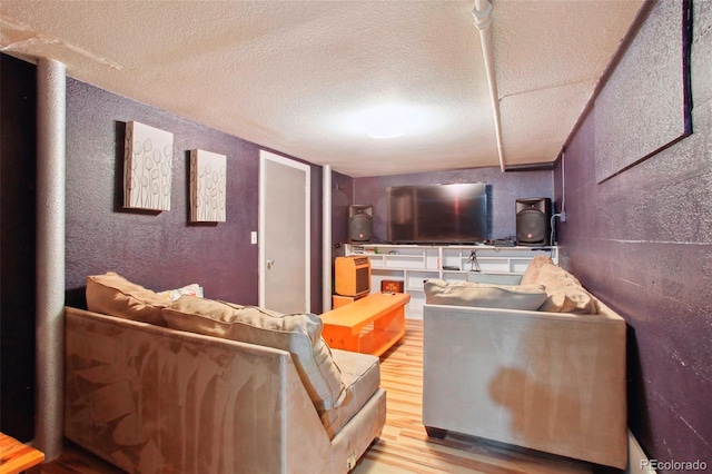 8001 W 57th Ave, Arvada, CO 80002 - living room with wood finished floors, a textured ceiling, and a textured wall