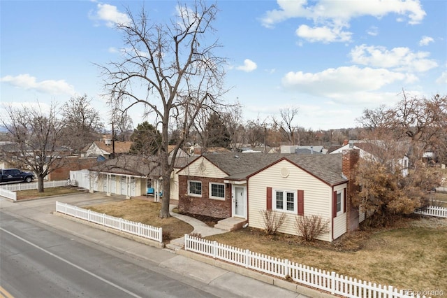 8001 W 57th Ave, Arvada, CO 80002 - ranch-style house featuring driveway, a chimney, and a garage