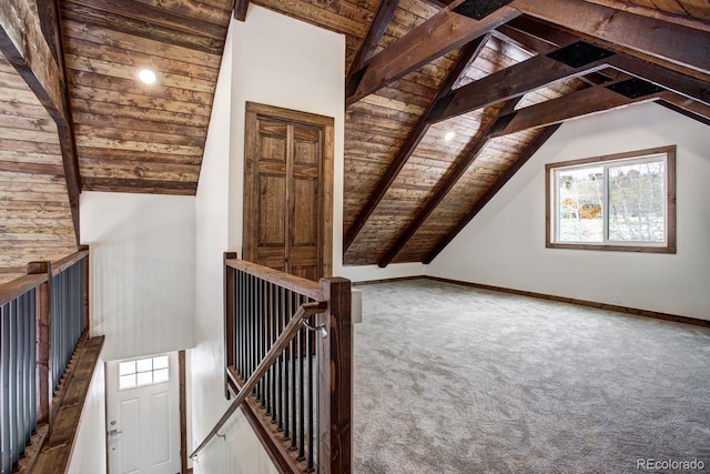 additional living space with high vaulted ceiling, carpet floors, wood ceiling, baseboards, and beam ceiling