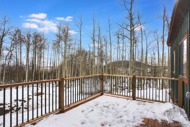 view of snow covered deck