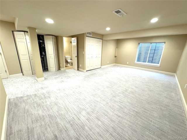 12743 W Bowles Pl, Littleton, CO 80127 - unfurnished bedroom featuring light carpet, recessed lighting, baseboards, and ensuite bathroom