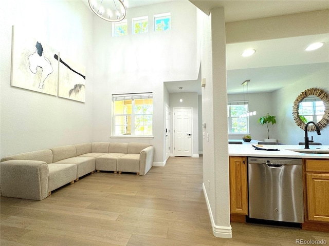 12743 W Bowles Pl, Littleton, CO 80127 - living area with a chandelier, light wood-type flooring, recessed lighting, and baseboards