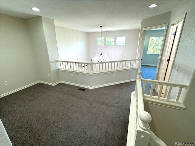 12743 W Bowles Pl, Littleton, CO 80127 - empty room featuring baseboards, dark carpet, and recessed lighting