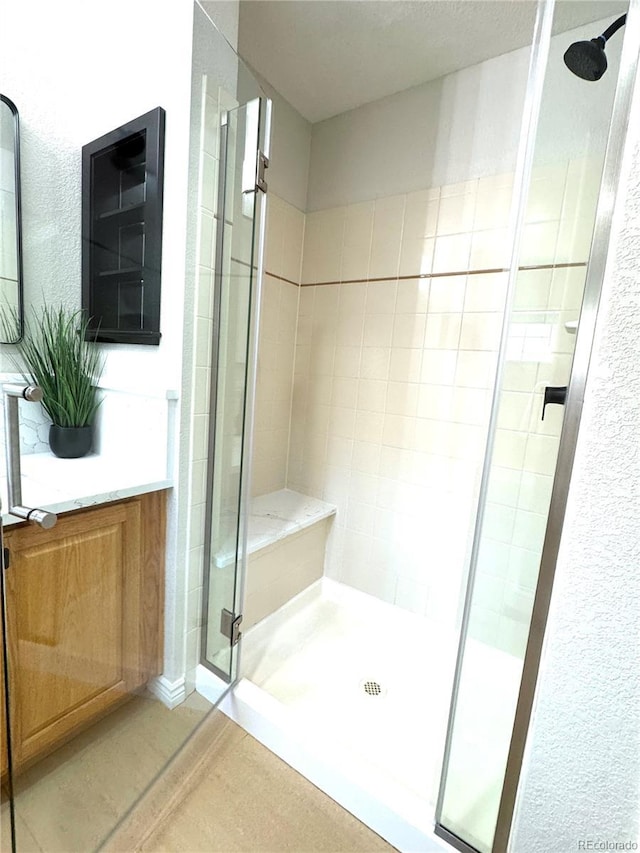 12743 W Bowles Pl, Littleton, CO 80127 - bathroom featuring a stall shower and vanity